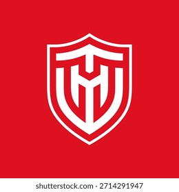 Um emblema minimalista que combina "T" e "M" com uma forma de escudo geométrico.