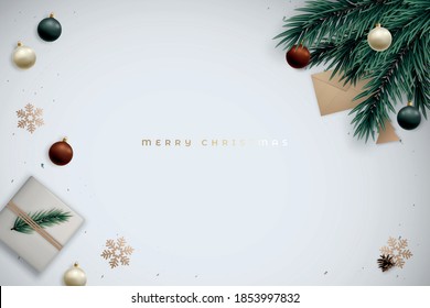 Minimalist festive fir branches banner with realistic gift box and shiny baubles. The background has gold snowflakes and space for text. Christmas flat lay composition. Vector design template.