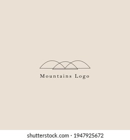 minimalist mountains logo design with brown background