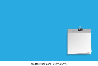 Minimalist template with copy space by top view close up macro photo of white notes paper on top on isolated blue background. Flash light made smooth shadow from paper.