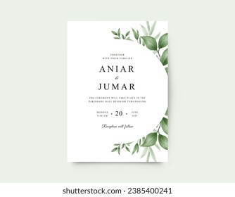 Minimalist wedding invitation card with watercolor green leaves