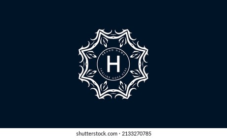 A minimalist, white, symmetrical logo with a large central letter 'H' encircled by floral patterns, Isolated on a dark background. The design has a modern, elegant feel, resembling a stylized mandala.