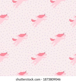 Minimalistic baby seamless pattern with simple unicorn silhouetes. Light pink background. Decorative backdrop for fabric design, textile print, wrapping, cover. Vector illustration