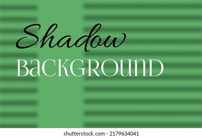 Minimalistic background in green color with a shadow from the blinds. A complex, delicate green shade. Blinds cast a shadow on the green wall.
