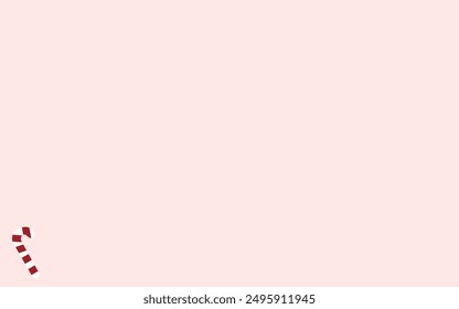 minimalistic Christmas background in soft pale pink color and Christmas caramel in the corner