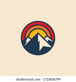 Minimalistic circular mountain logo icon design template with mountain peak and sunset. Vintage styled vector illustration.