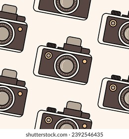 Minimalistic seamless pattern brown vintage camera in retro colors, isolated on a light background. Background, backdrop, wrapping paper, sepia tone.
