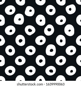 Minimalistic seamless pattern with circles. Hand-drawn elements for textile design. Black and white, clean, simple monochrome design