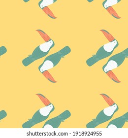 Minimalistic tropical seamless pattern with blue colored toucan bird print. Light orange background. Flat vector print for textile, fabric, giftwrap, wallpapers. Endless illustration.