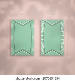 Mint color business card with Greek white ornament for your contacts.