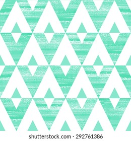 Mint green and white triangles seamless vector pattern. Acrylic brush drawn geometrical background.