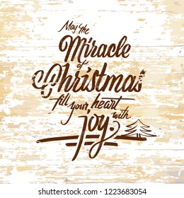 Miracle Christmas lettering on wooden background. Vector illustration drawn by hand.