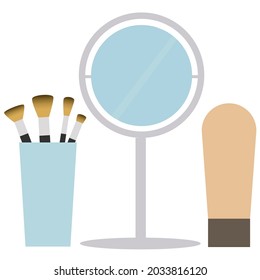 mirror with brushes and foundation on white background