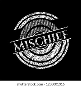Mischief chalk emblem written on a blackboard