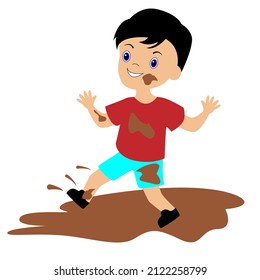 A mischievous and cheerful boy got dirty in a muddy puddle. 