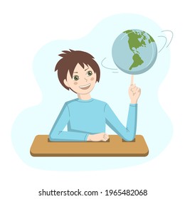 
Mischievous child at a desk in a geography lesson with a globe in his hands.
