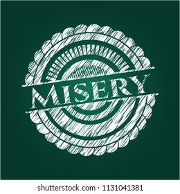 Misery chalk emblem written on a blackboard