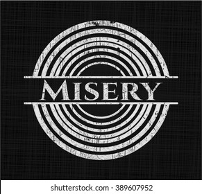 Misery chalk emblem written on a blackboard
