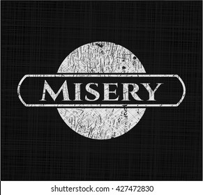 Misery chalk emblem written on a blackboard