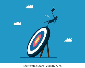 Missed the target. Businesswoman slips and falls on target