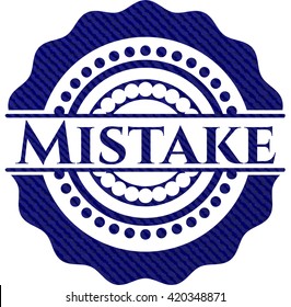 Mistake-Emblem mit jean-Struktur