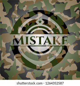 Mistake written on a camo texture