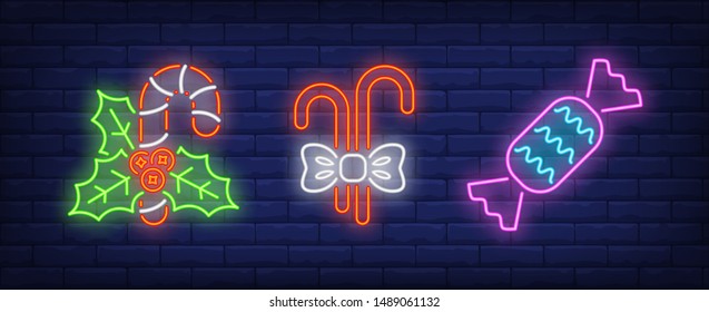 Mistletoe, candy canes and sweet neon signs set. Christmas, New Year Day, celebration design. Night bright neon sign, colorful billboard, light banner. Vector illustration in neon style.