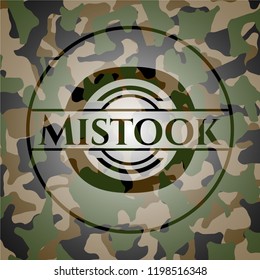 Mistook written on a camo texture