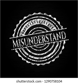 Misunderstand chalk emblem written on a blackboard