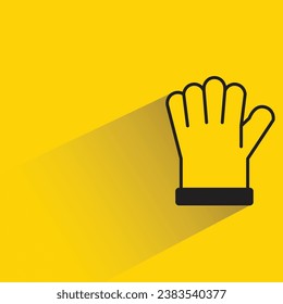 mitten with shadow on yellow background