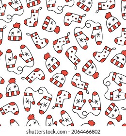 Mittens, hats and socks with red elements. Christmas seamless pattern. Winter doodle background. Ideal for wrapping paper, textiles and holiday decorations. Vector illustration.