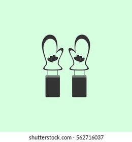 Mittens winter icon flat. Grey vector symbol on green background