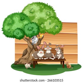 Mix animals sitting under a tree