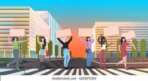 mix race activists protesting holding blank placards feminist demonstration girl power movement rights protection women empowerment concept cityscape background full length horizontal vector