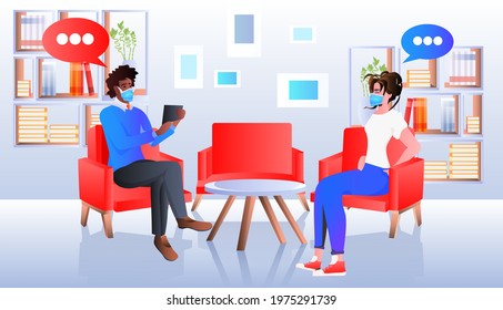 mix race businesspeople in masks discussing during meeting in library or book shop coronavirus quarantine concept