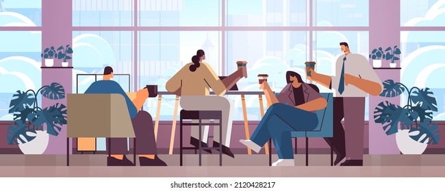 mix race businesspeople sitting at cafe table and drinking coffee during meeting modern cafeteria interior