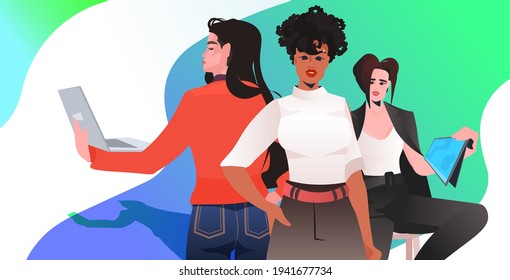 mix race businesswomen in formal wear standing together successful business women using digital gadgets