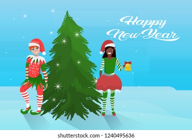 mix race couple boy girl elf costume near fir tree happy new year merry christmas concept flat horizontal