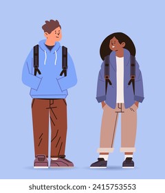 mix race couple of junior students with backpacks in casual clothes standing together education day concept full length