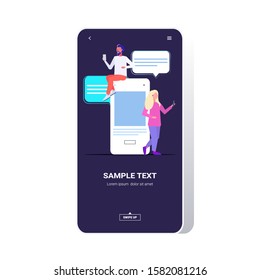 mix race couple using chatting app social network chat bubble communication concept man woman near smartphone screen online mobile application full length vector illustration