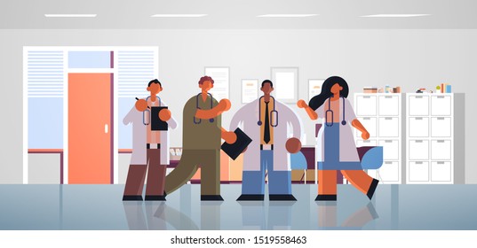 mix race doctors team discussing during meeting medicine healthcare concept modern hospital office interior full length flat horizontal