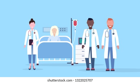 mix race doctors team visiting patient senior woman lying bed intensive therapy ward healthcare concept hospital room blue background modern medical clinic horizontal