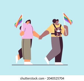 mix race female parents walking with little child lesbian family transgender love LGBT community concept