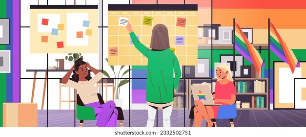 mix race girls in colorful clothes working in office lgbt rainbow flag transgender love generation Z concept