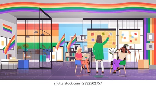 mix race girls in colorful clothes working in office lgbt rainbow flag transgender love generation Z concept