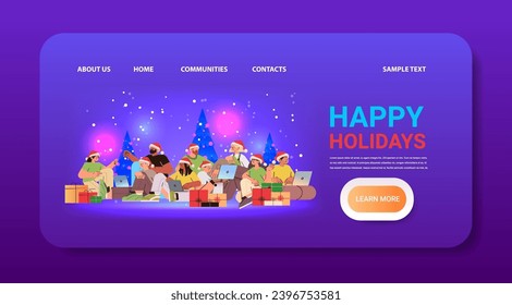mix race men women in santa hats near decorated christmas tree using laptops social media communication new year holidays celebration