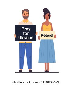 mix race patriots couple holding protest banners pray for Ukraine peace save Ukraine from russia stop war concept