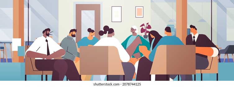 mix race people communicating while sitting in circle therapy group meeting addiction treatment concept