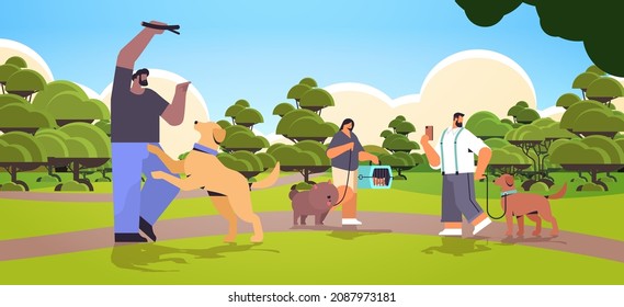 mix race people walking with dogs owners and cute domestic animals having fun friendship with pets concept