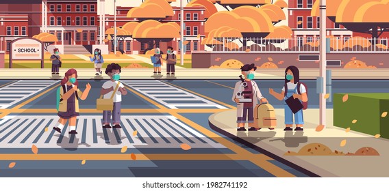 mix race schoolchildren in masks crossing road on crosswalk pupils walking to school coronavirus pandemic concept